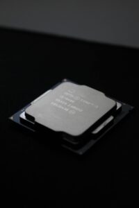 Detailed close-up image of a computer processor chip on a dark background.